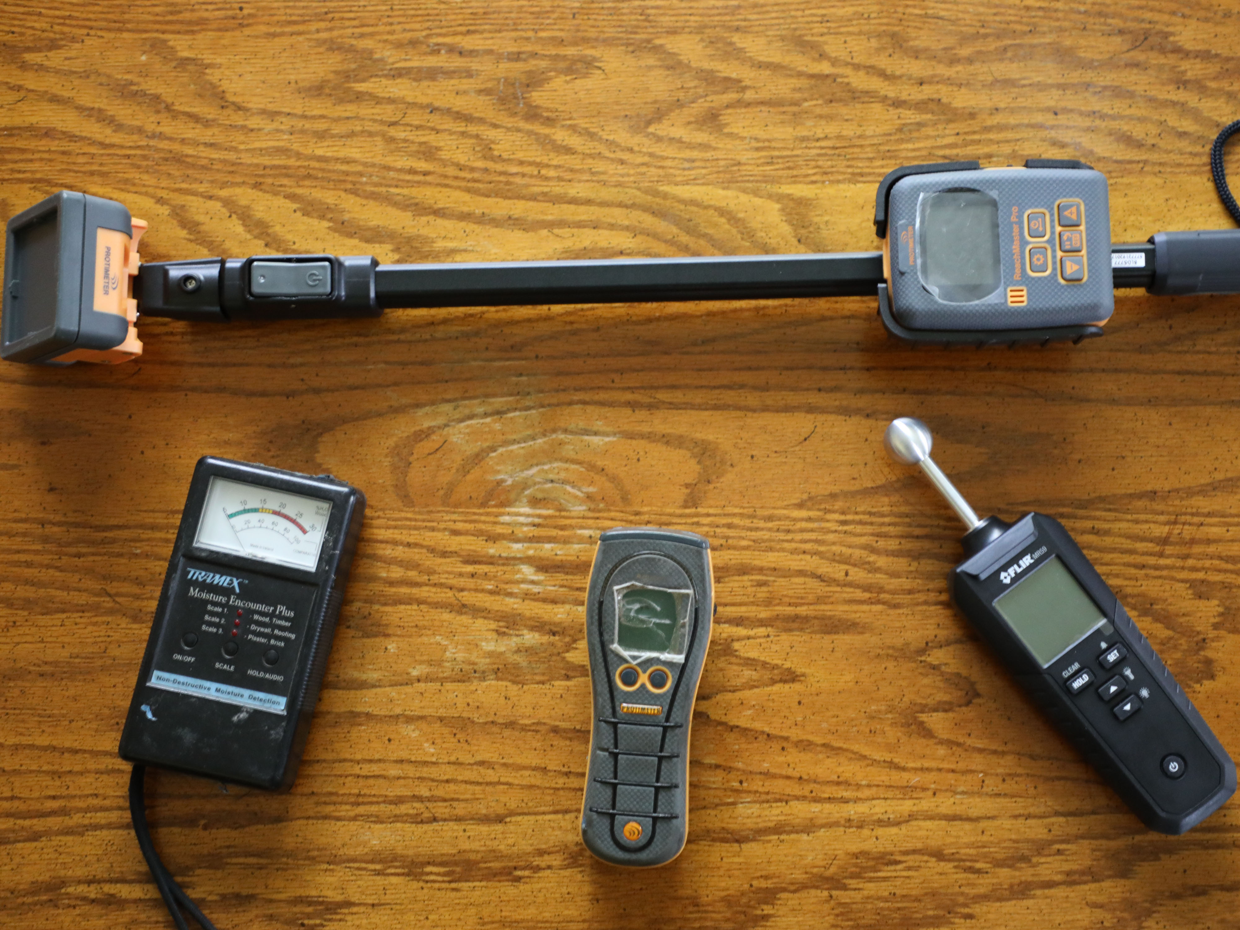 four different moisture meter inspection devices